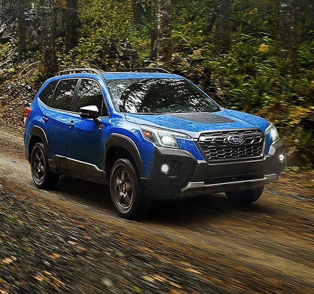 A 2022 Forester driving on a highway. | Subaru World of Hackettstown in Hackettstown NJ