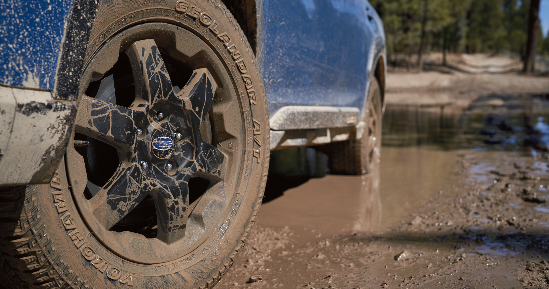 A close-up of the 17-inch off-road wheels and all-terrain Yokohama GEOLANDAR® tires on the 2023 Outback Wilderness. | Subaru World of Hackettstown in Hackettstown NJ