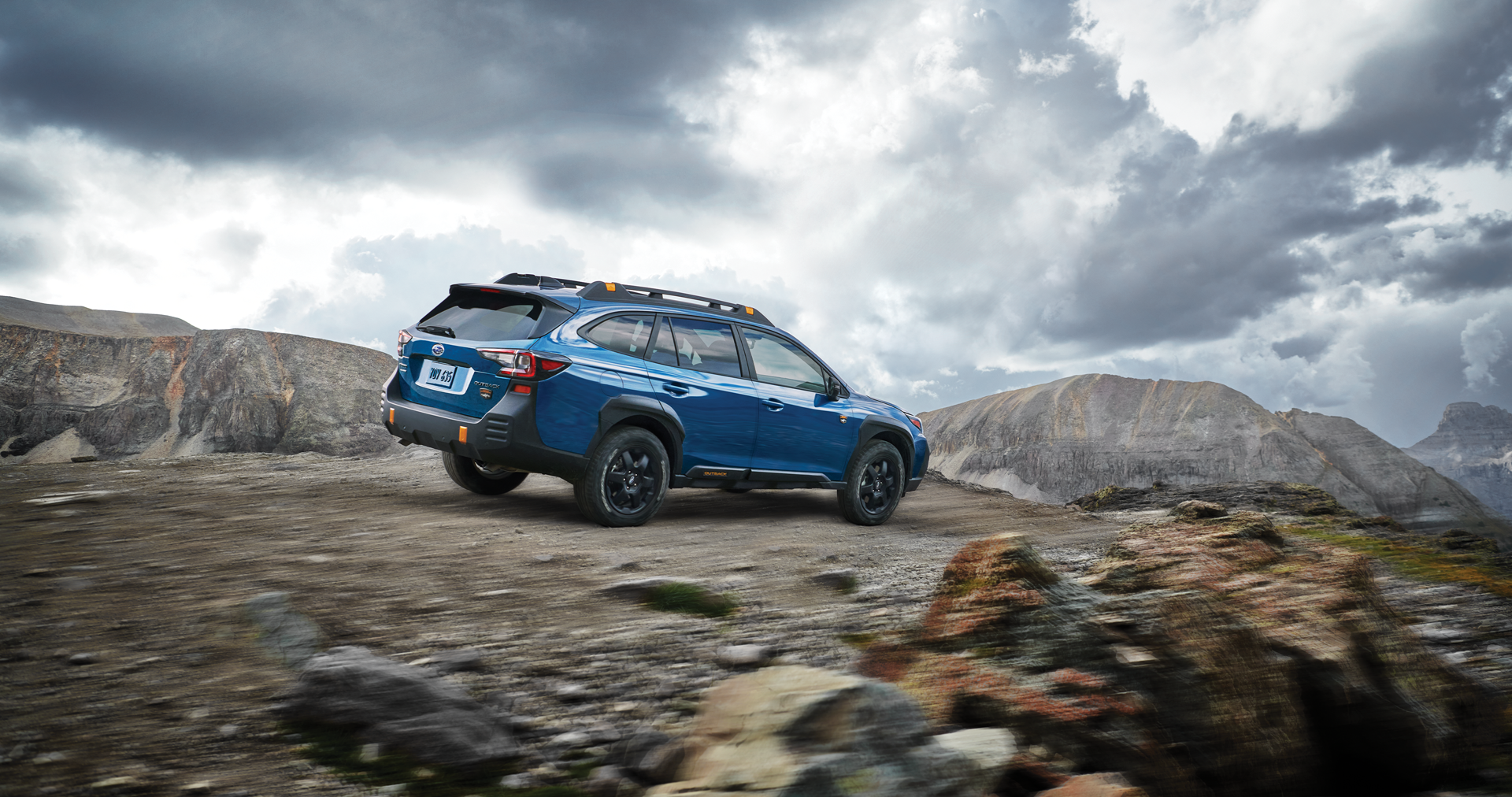 A 2023 Outback Wilderness driving on a trail in the mountains. | Subaru World of Hackettstown in Hackettstown NJ